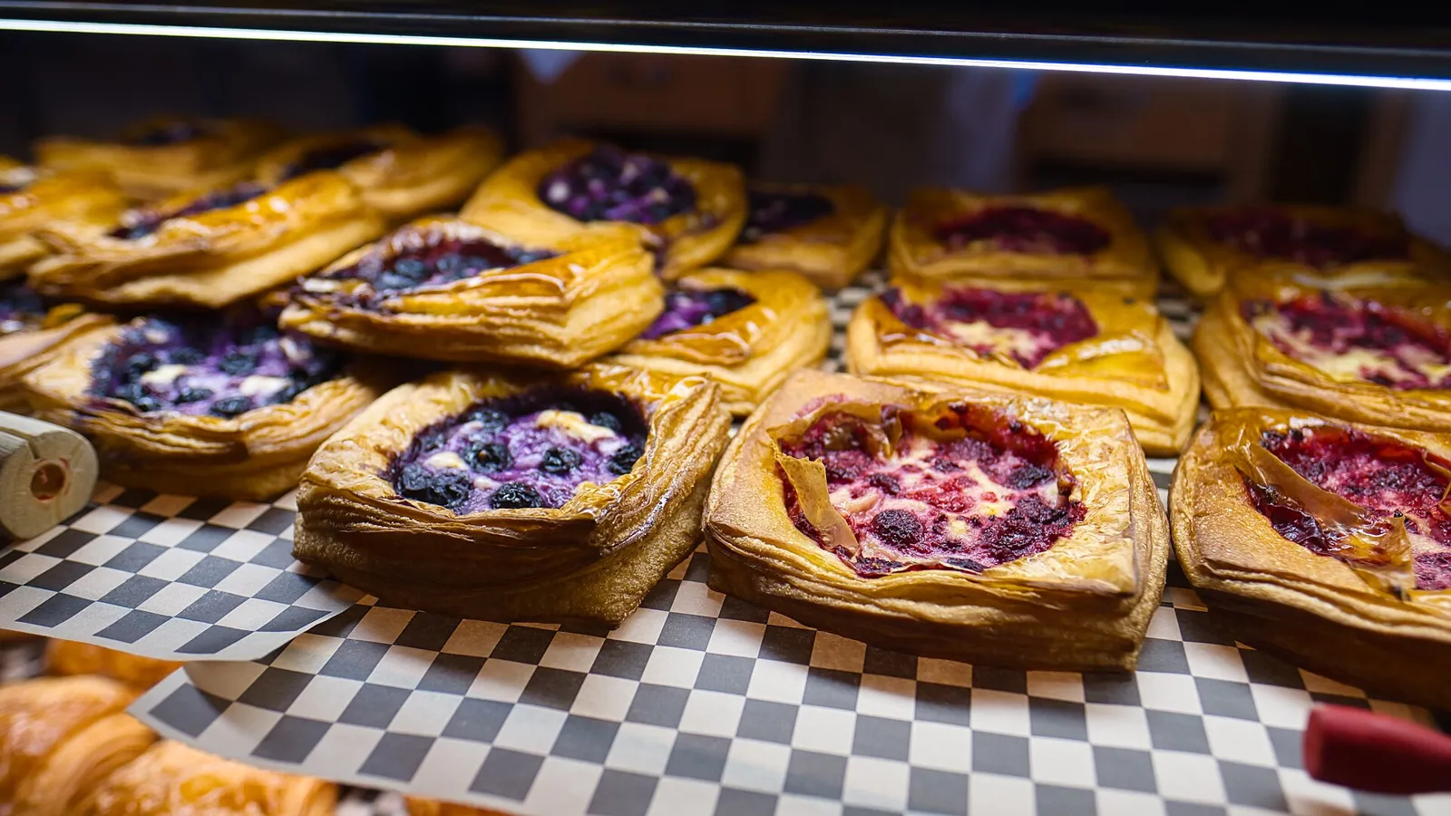 Pastries on display in a bakery case. The photo was not taken in Coral Springs.