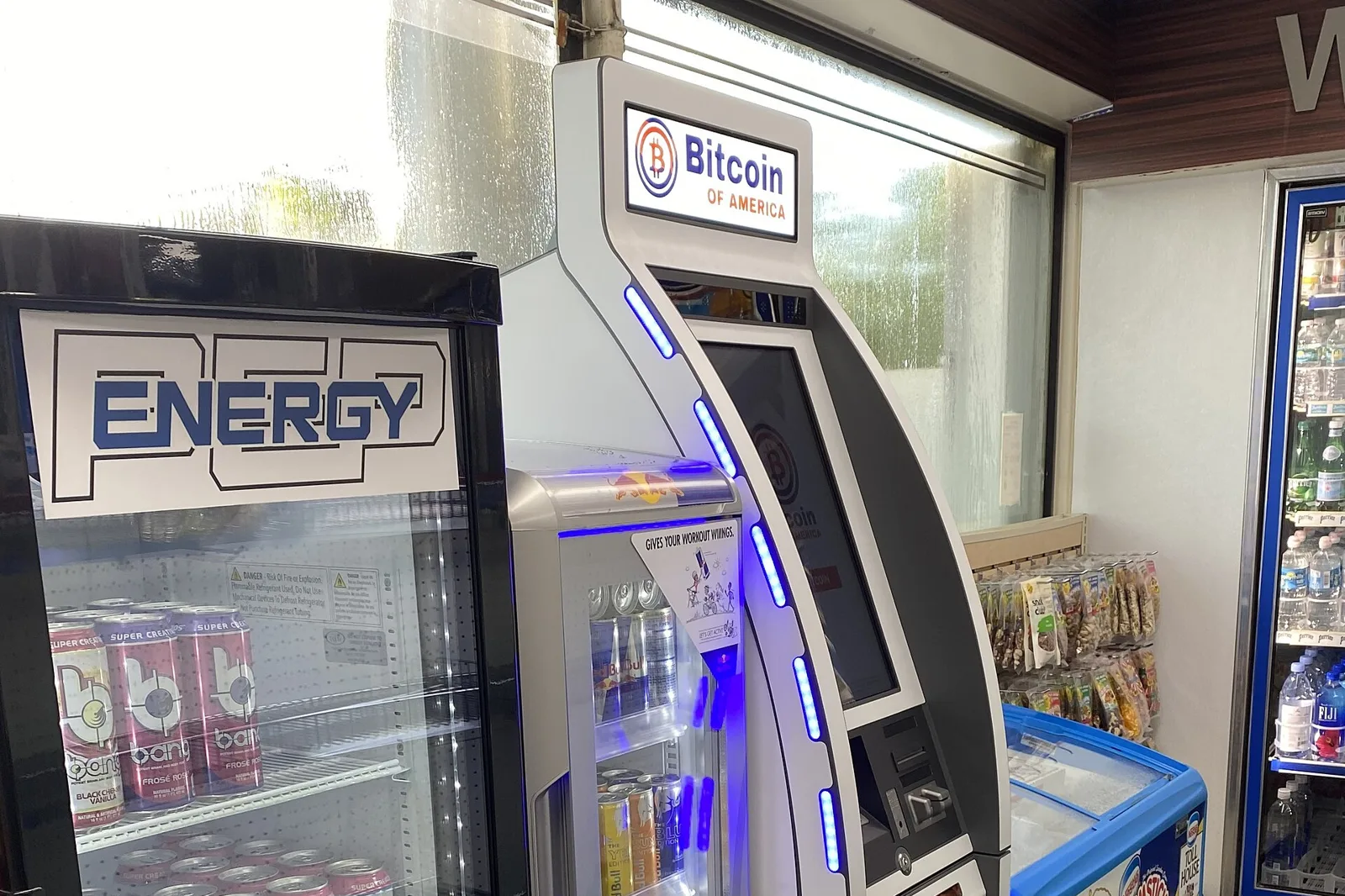A Bitcoin kiosk beside the drinks coolers in a gas station store in Miami-Dade County.