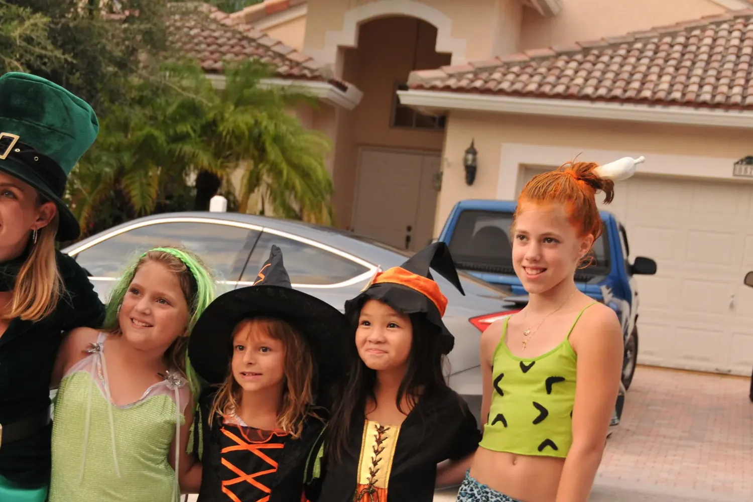 Children in Halloween costumes on a Coral Springs street