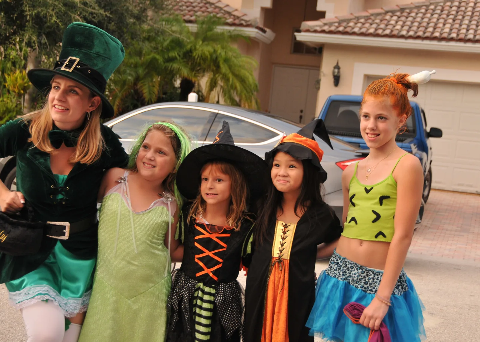 Children in Halloween costumes on a street in the Pinecrest neighborhood of Coral Springs.