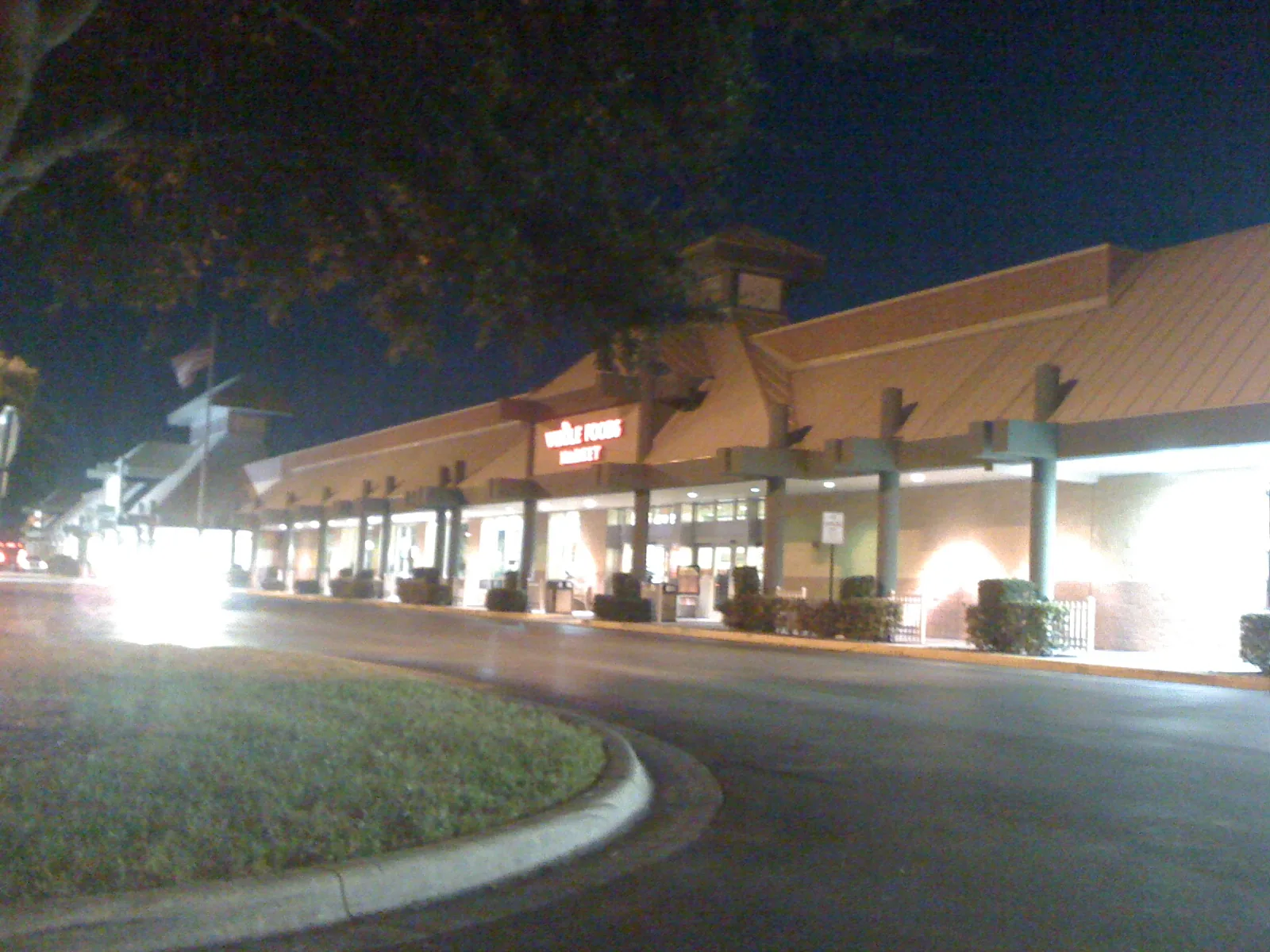 Storefronts in a Coral Springs shopping plaza at night