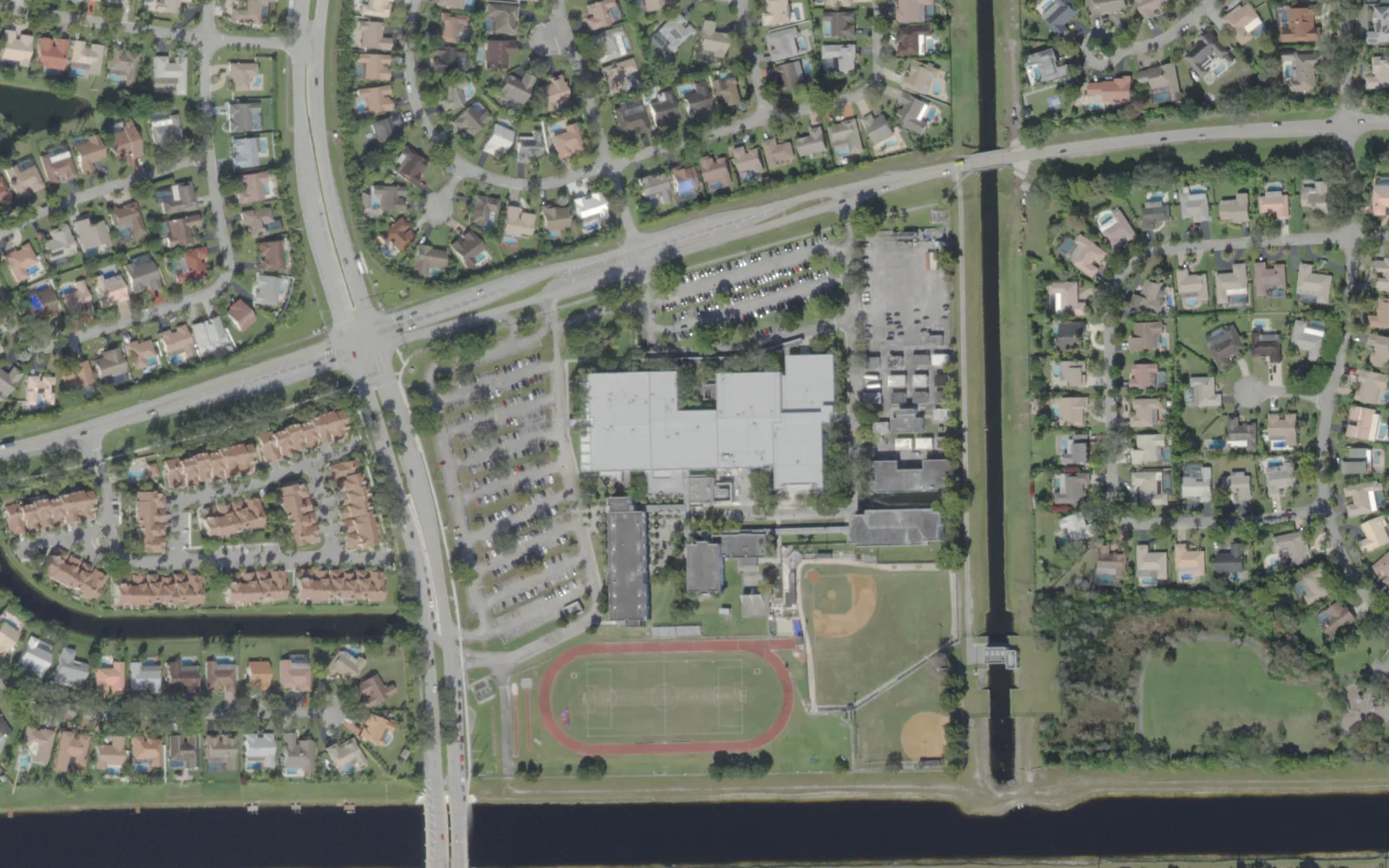 J.P. Taravella High School's main building, track and ball fields in southern Coral Springs, seen from the air