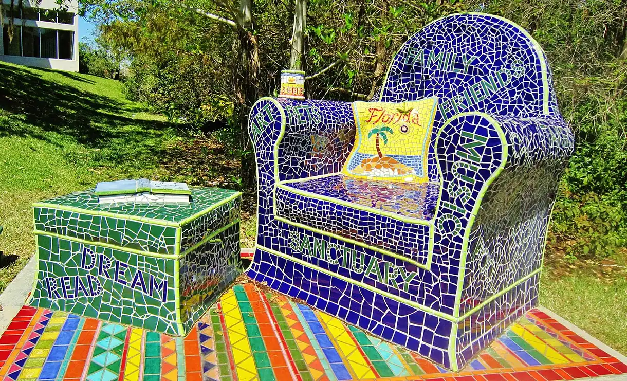 A mosaic chair and table in the garden of the Coral Springs Museum of Art