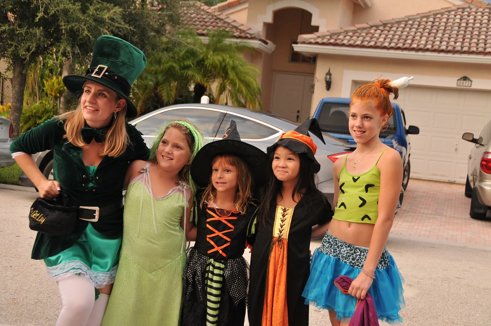 Children in Halloween costumes on a Coral Springs street