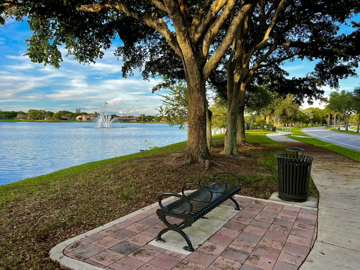 A bench beside the lakeside path in Winston Park, Coral Springs